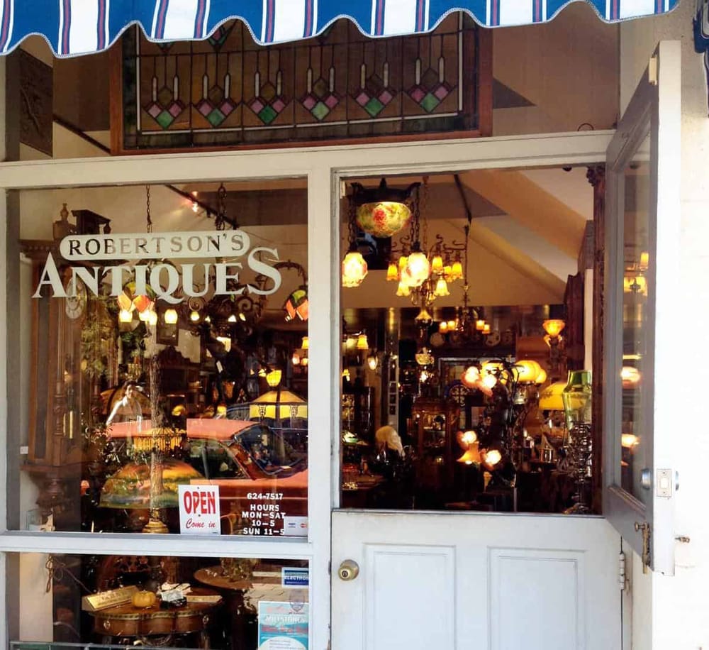 Vintage antique shop with eclectic lighting and decor, located in downtown QuestForDirections.