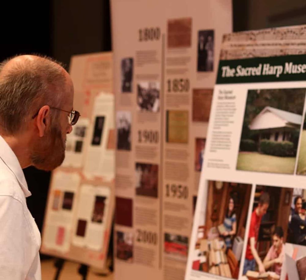 Colorful museum exhibit displays on historical topics, showcasing educational posters and artifacts at QuestForDirections.