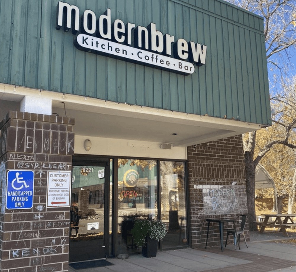 Handicapped accessible coffee shop exterior, Modernbrew Kitchen Coffee Bar, with welcoming entrance and outdoor seating.