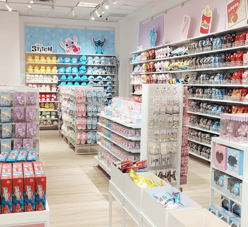 Colorful gift shop with plush toys, accessories, and candy displays, perfect for kids and visitors.