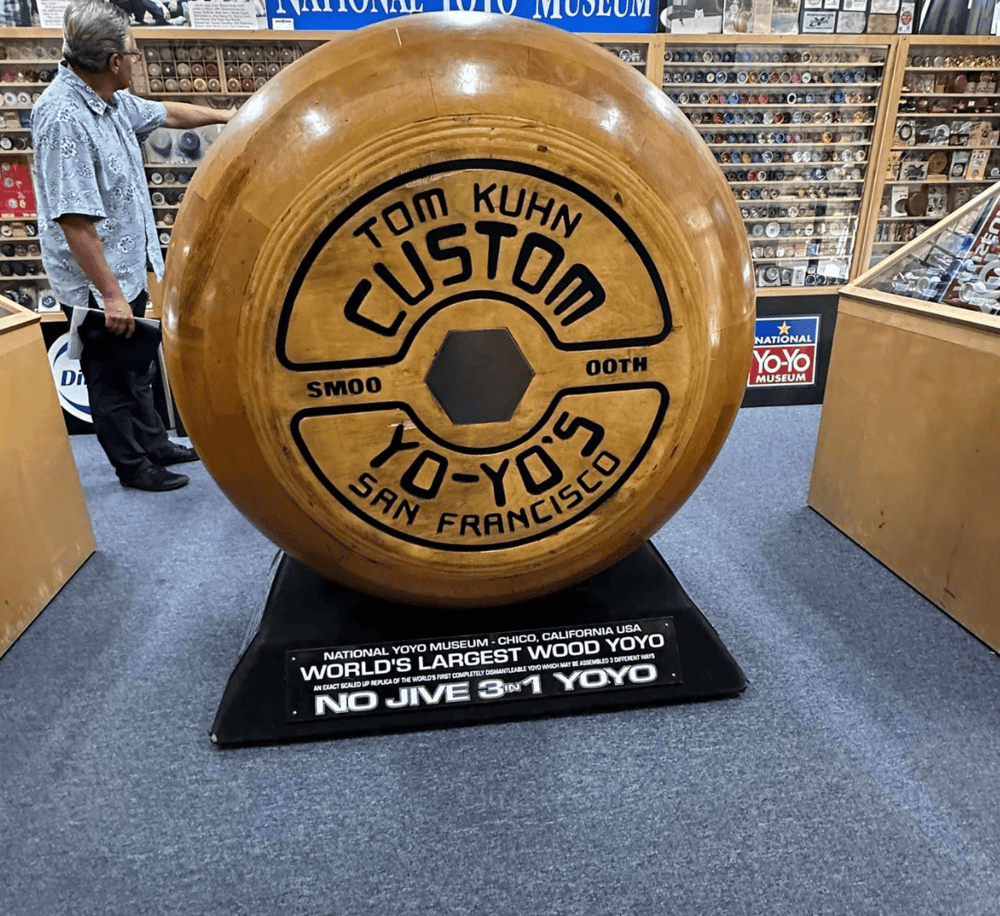 Handcrafted wooden Yo-Yo display at National Yo-Yo Museum, showcasing the world's largest wooden Yo-Yo in San Francisco.
