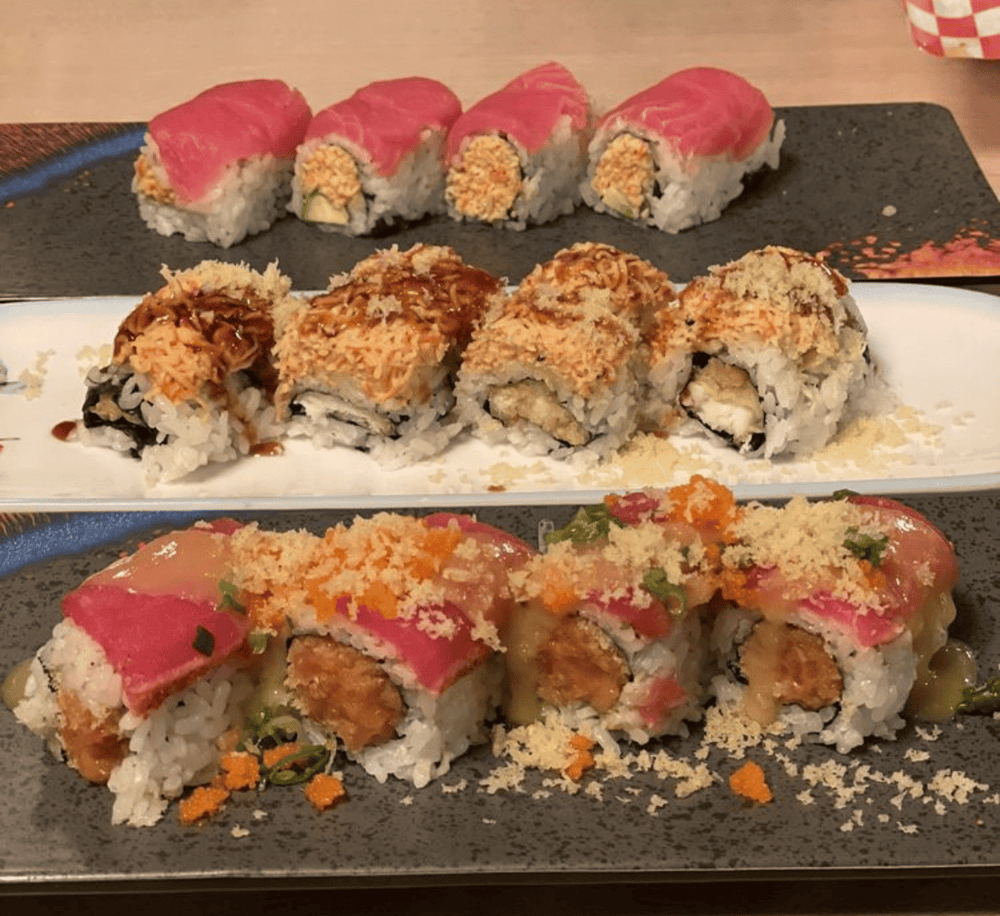 Deluxe sushi rolls featuring fresh fish, tempura, and flavorful toppings at QuestForDirections.