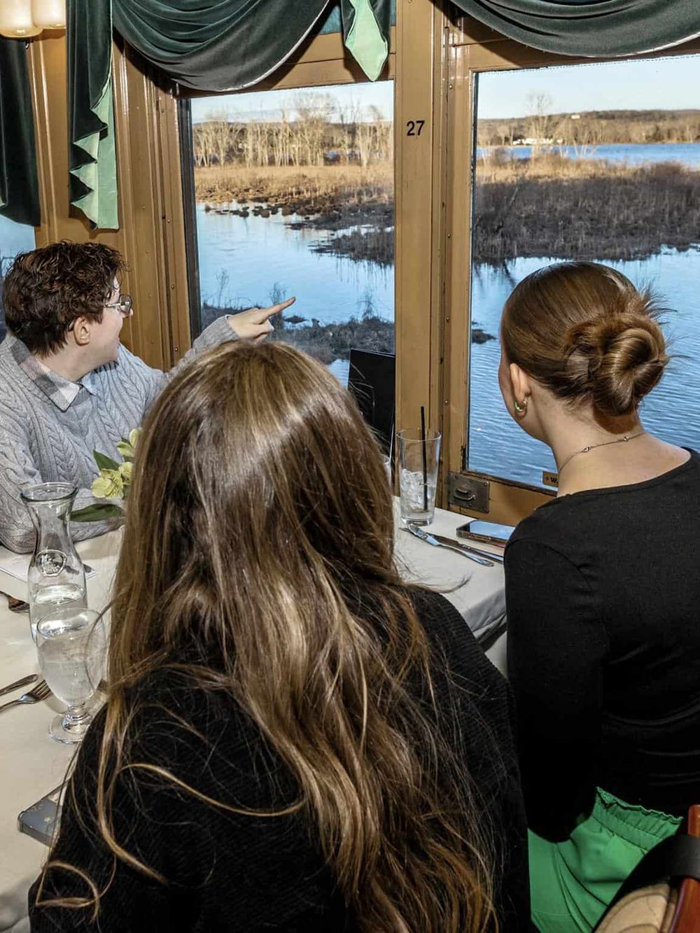 Captions and descriptions must be in English, but I see that the image is from a restaurant or a dining setting with a view outside. Based on this, here are the SEO-optimized text values:.