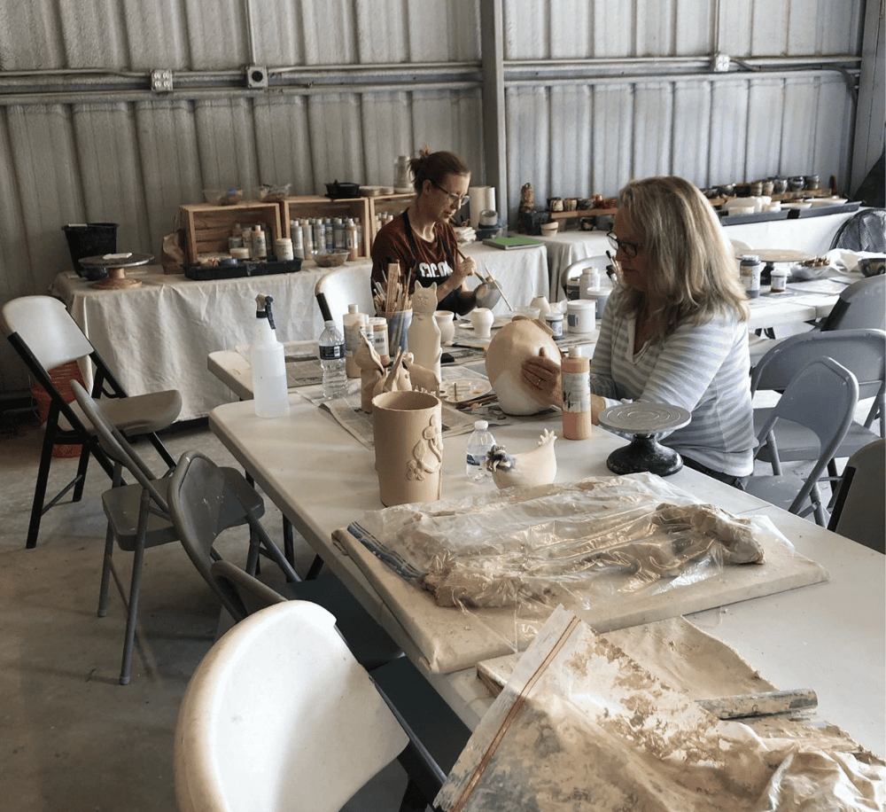 1. Women creating Ceramic art in a pottery studio for creative therapeutic experience.