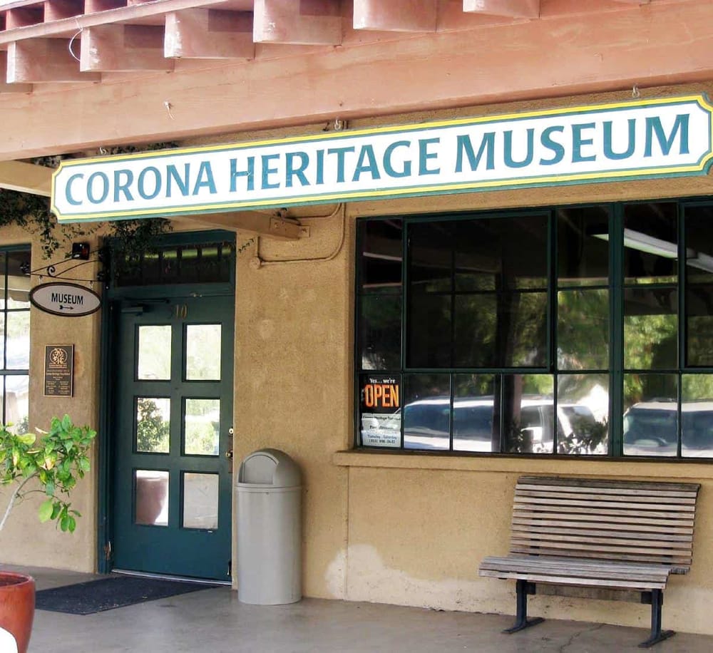 Colorful sign for Corona Heritage Museum showcasing local history and culture.