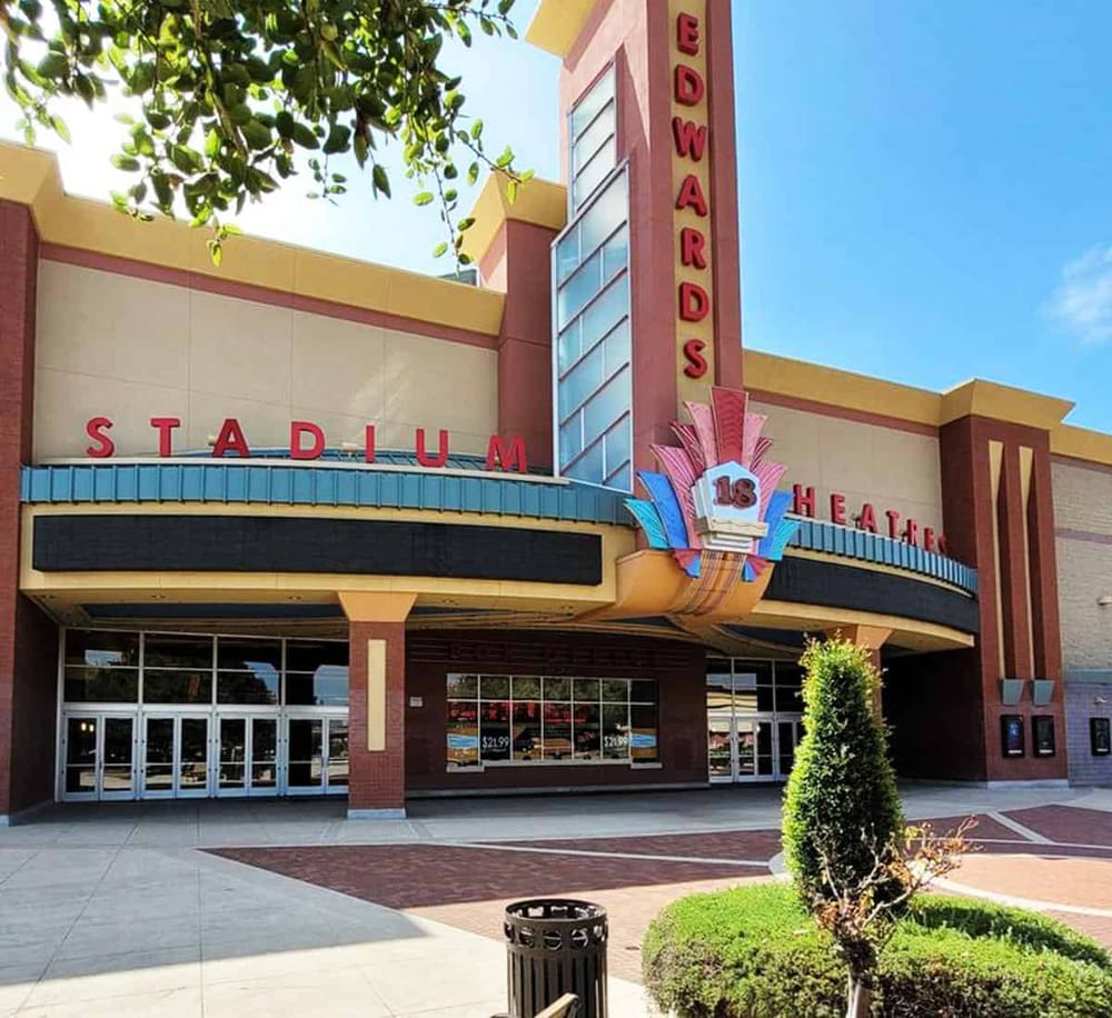 Colorful stadium entrance with marquee signage and art deco design, perfect for entertainment and sports events.