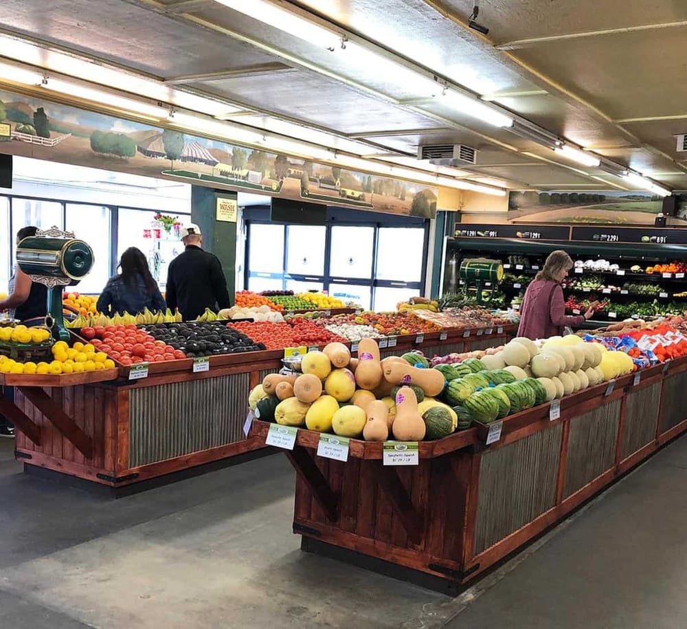 Fresh organic produce at local farmers market, vibrant fruits and vegetables, farm-to-table shopping experience.