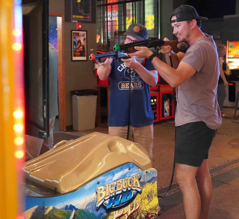 Boutique arcade shooting game experience at QuestForDirections in an arcade center.