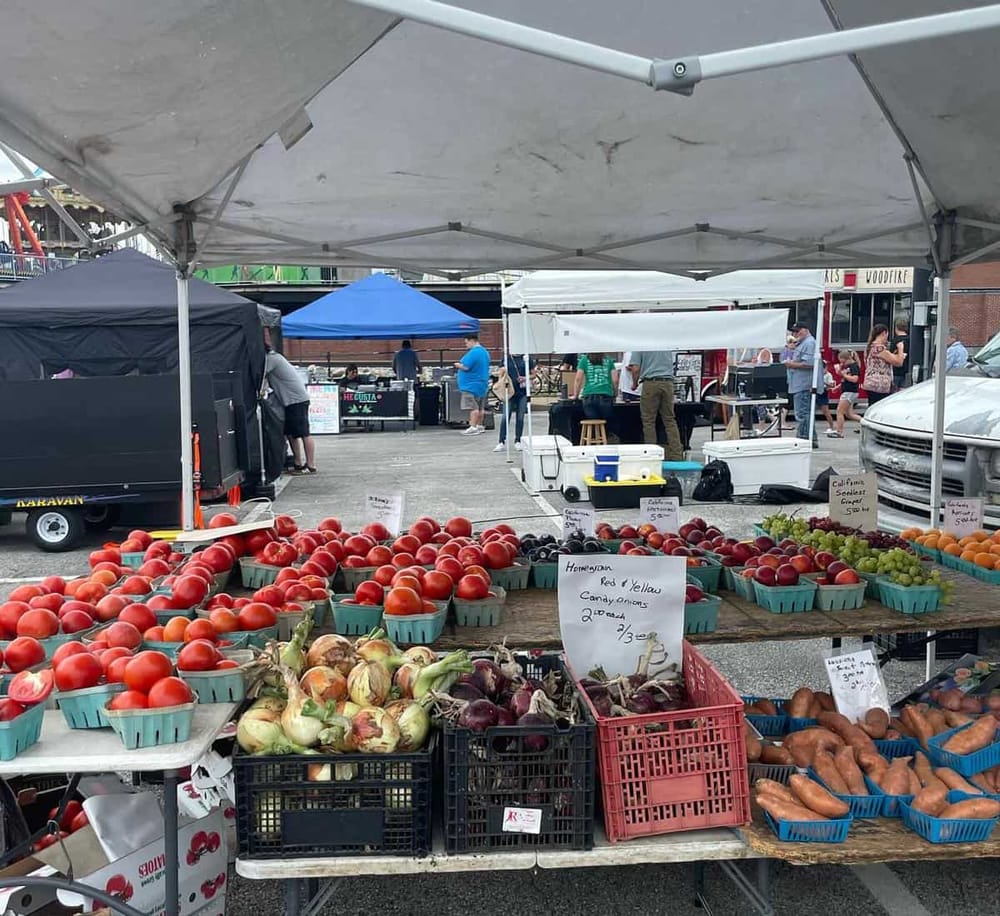 Fresh local produce at a vibrant farmers market in QuestForDirections community.