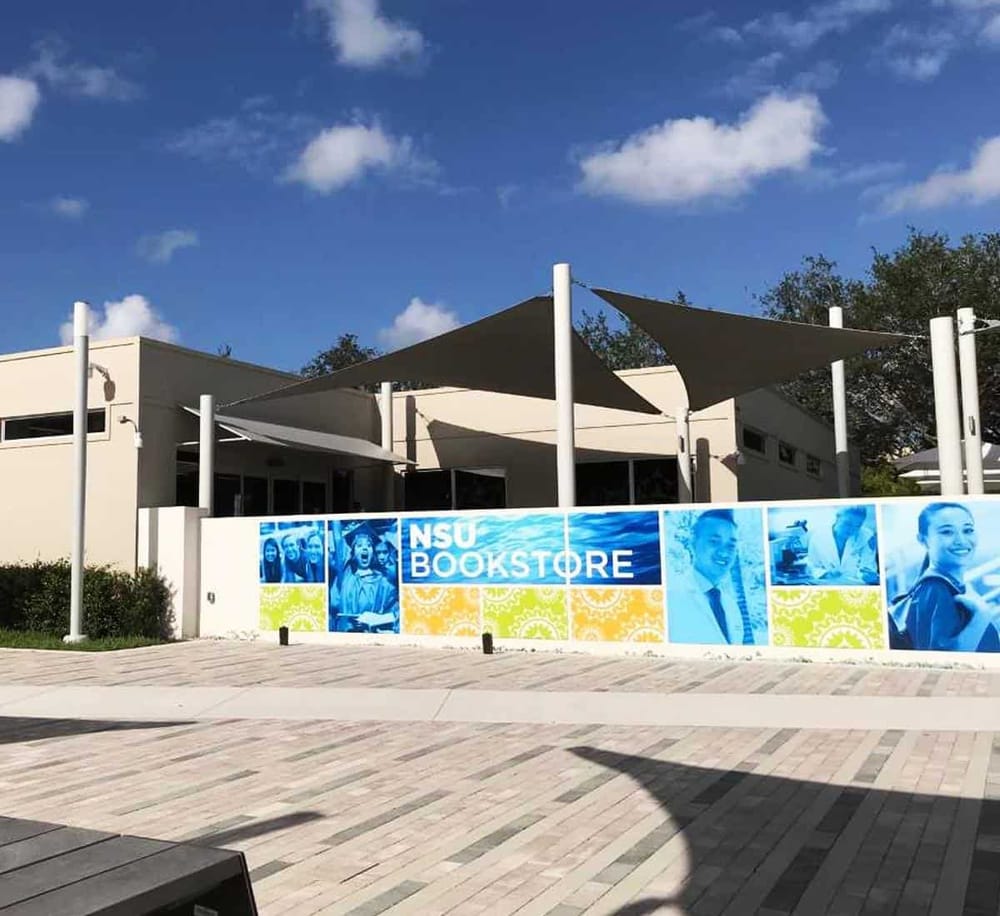 Modern NSU bookstore at Florida International University with shaded outdoor seating area.