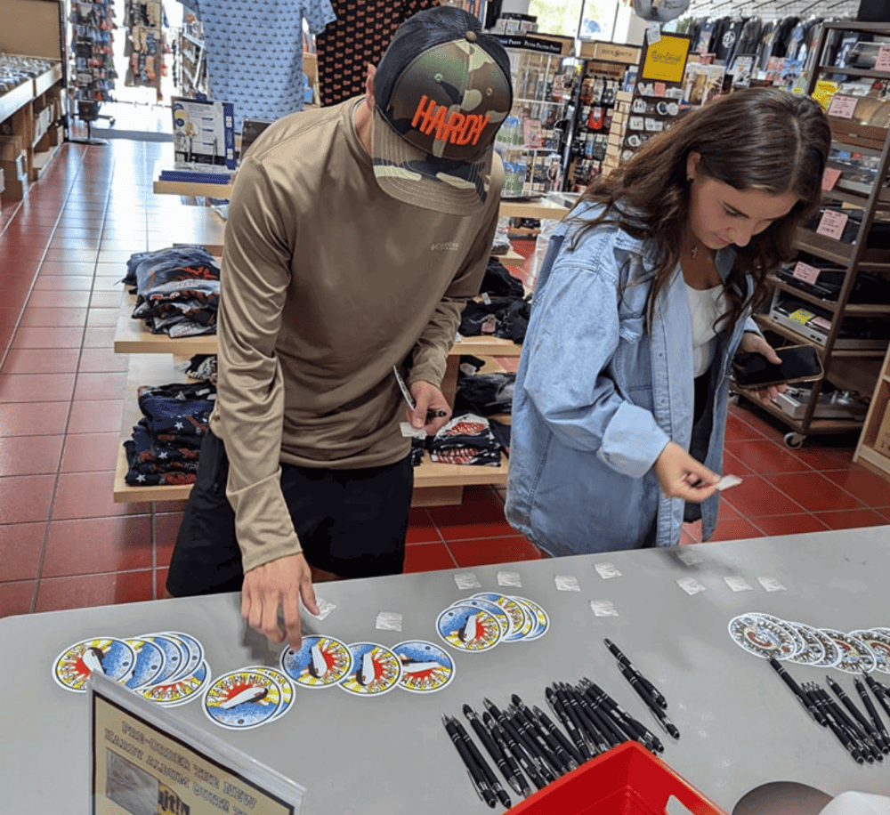 1. People playing a social game at a table in a retail store, with merchandise in the background.