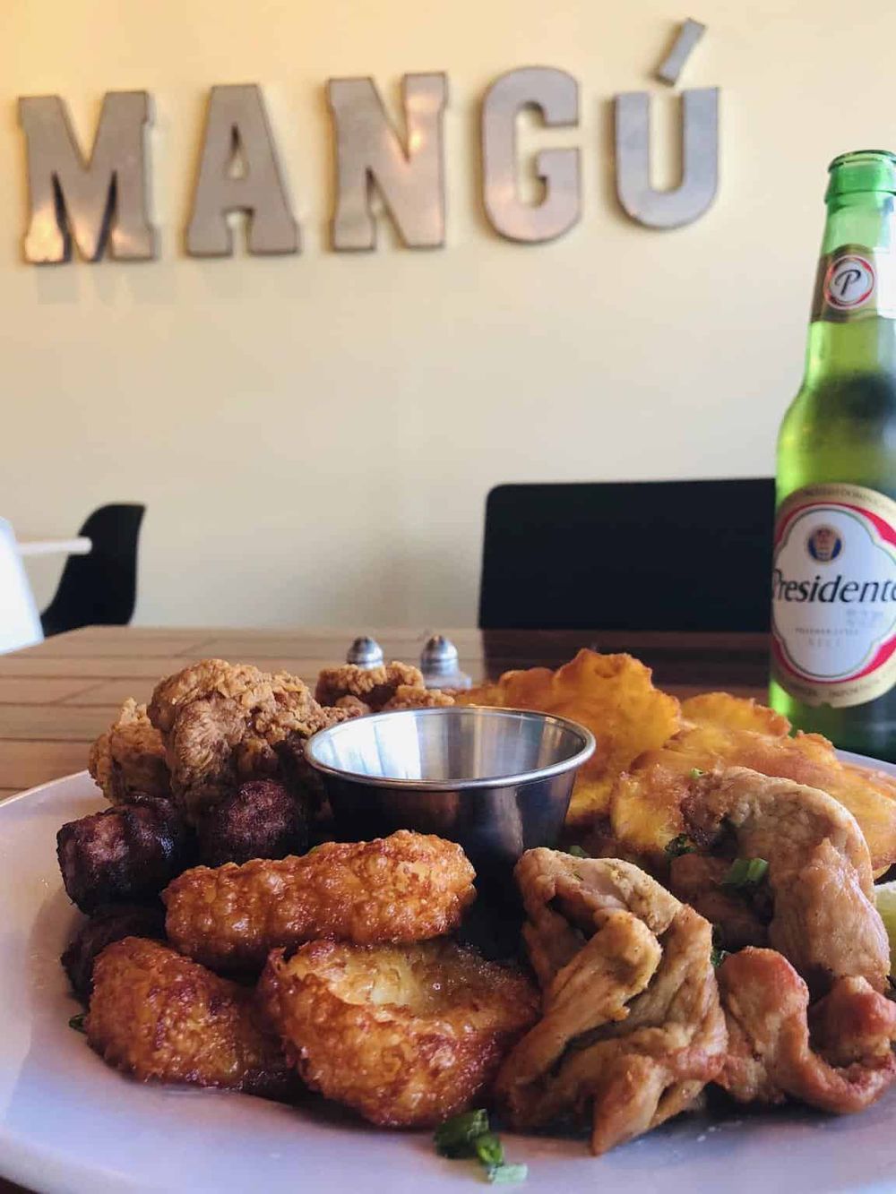 Delicious Filipino fried chicken and wings with tropical pineapple drink at Mango restaurant.