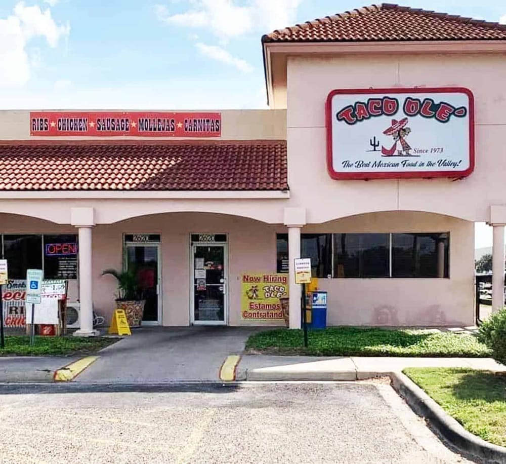 Authentic Mexican restaurant Taco Ole with traditional decor and menu, serving ribs, chicken, sausage, and more.