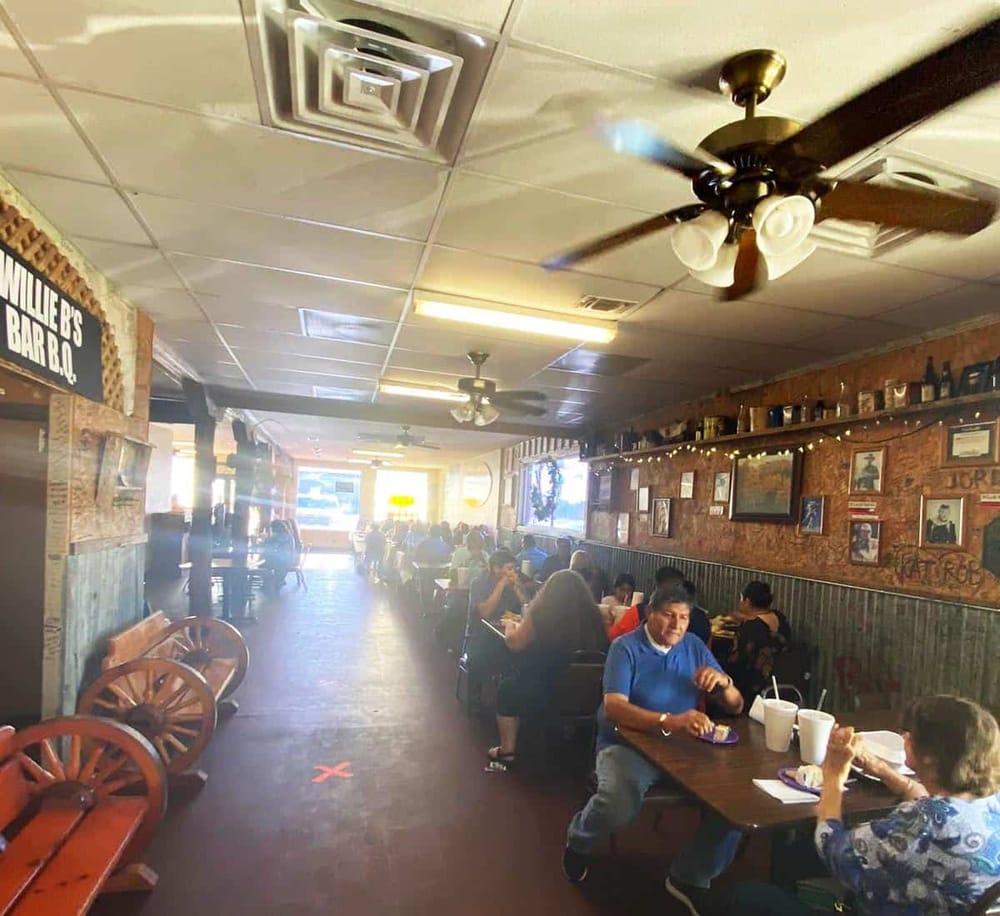 Delicious barbecue dishes served at Willie’s Bar-B-Q restaurant with cozy interior ambiance.