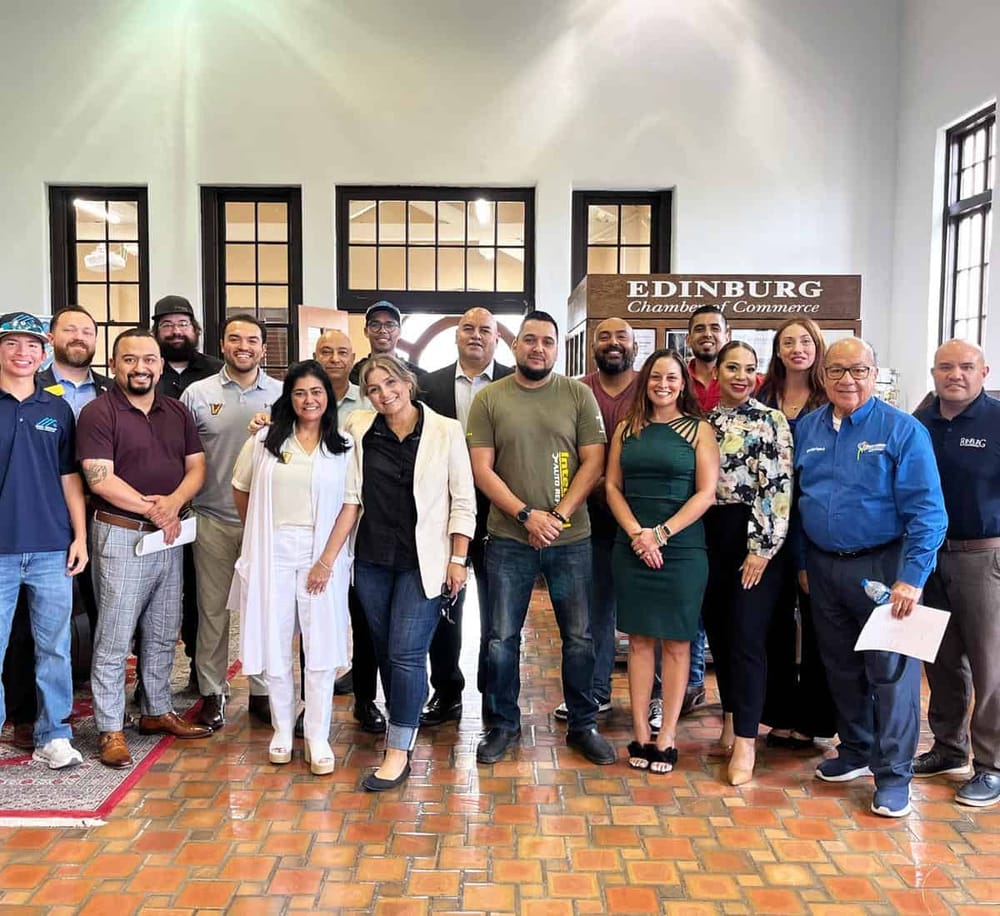 Group of diverse professionals at QuestForDirections event in Edinburgh Chamber of Commerce, showcasing community engagement and networking.