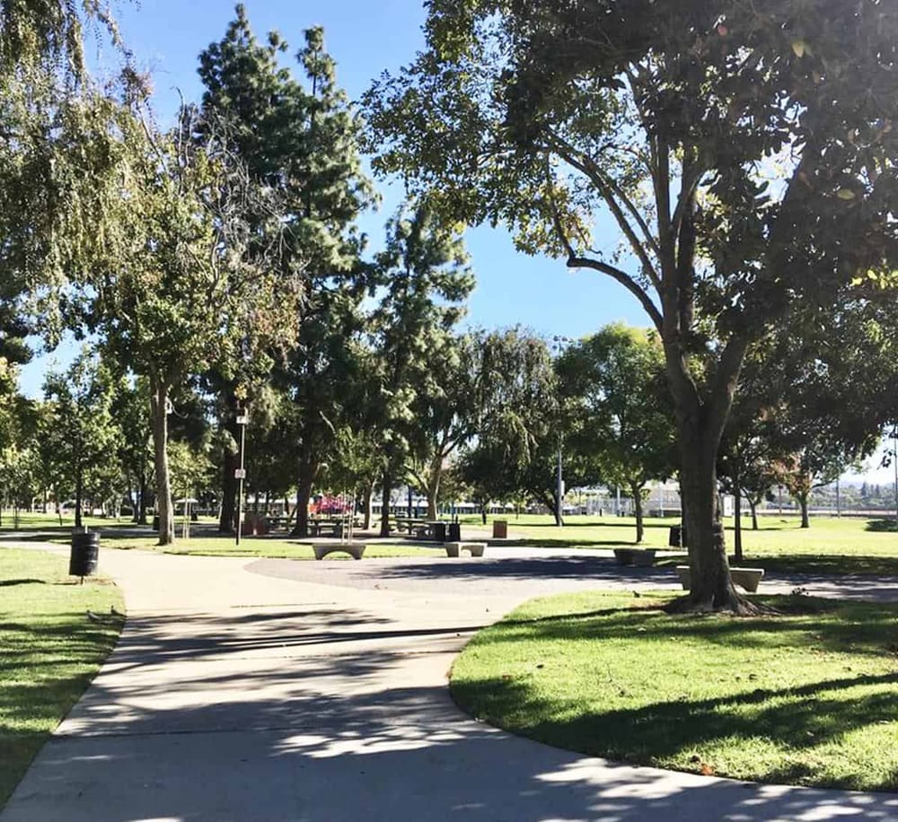 Enjoy scenic park pathways with lush trees and open spaces for outdoor activities.