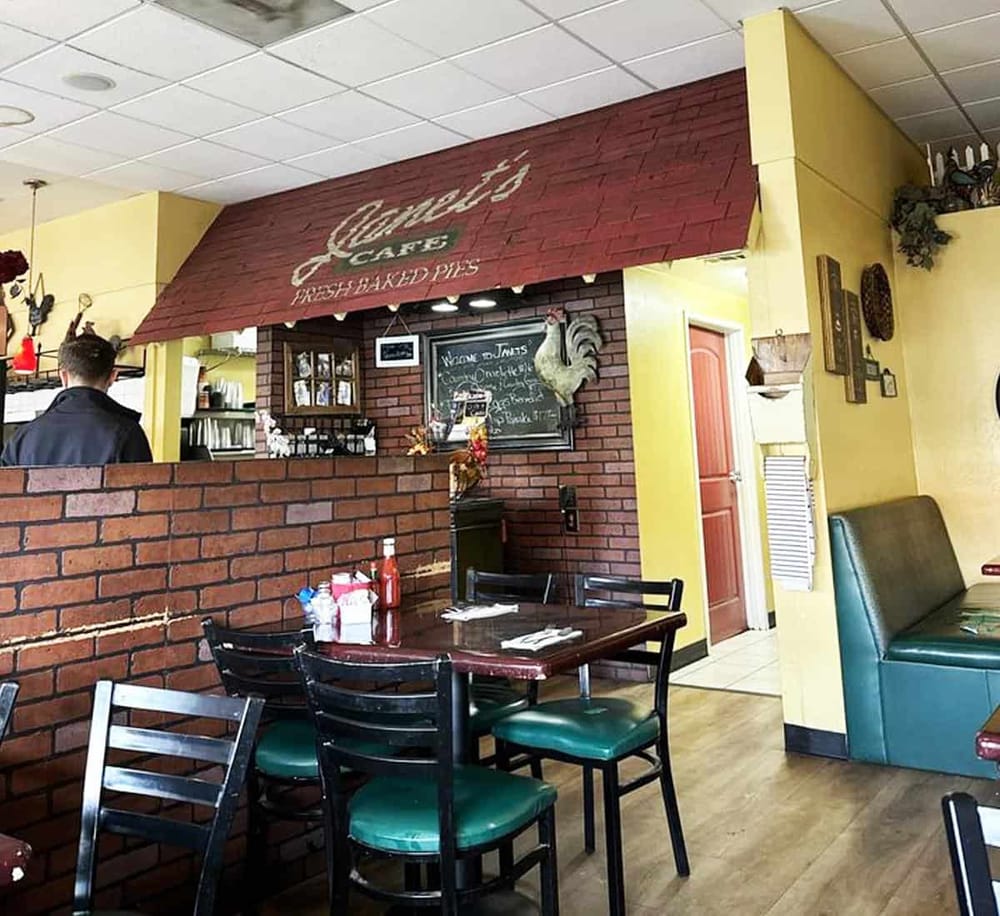 Fresh baked pies and cozy dining area at Quest for Directions restaurant.