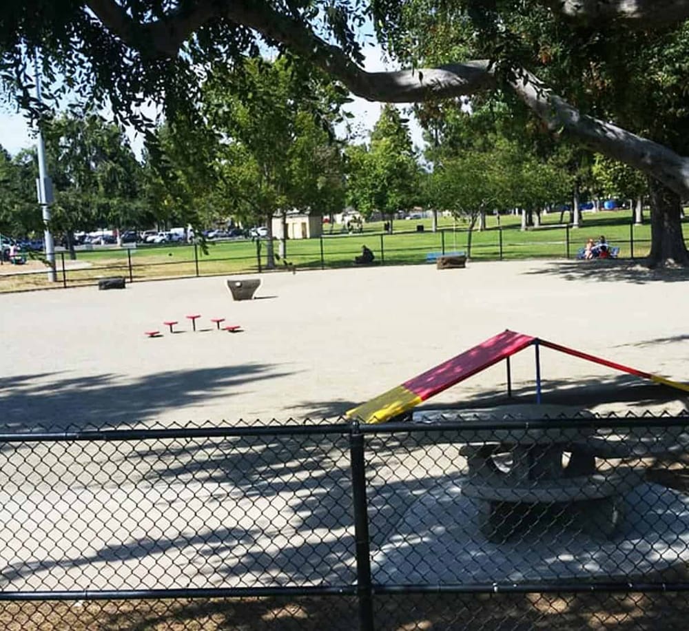 Quiet city park with playground and picnic area for outdoor family activities.