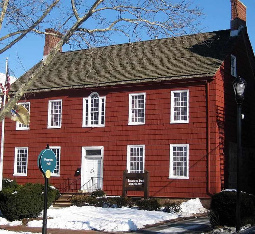 1. Historic red house on snow-covered street, Boston, MA.
