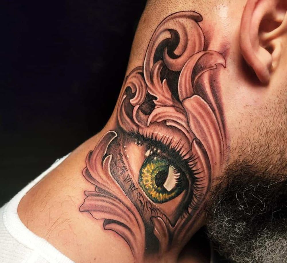 Vivid eye tattoo design with intricate details and bold colors.