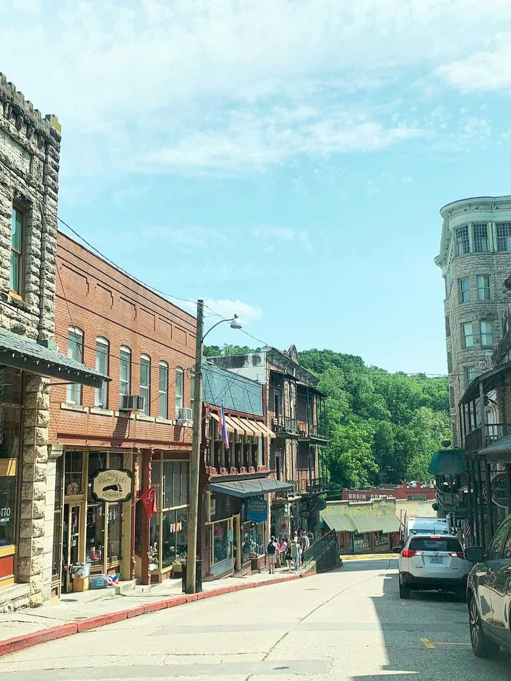 Charming historic downtown street with vintage buildings and local shops, perfect for exploring in quest for directions.