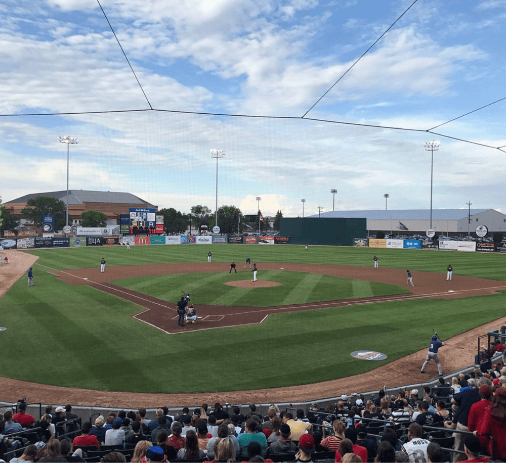 Affordable baseball stadium with a lively crowd and engaging game atmosphere.