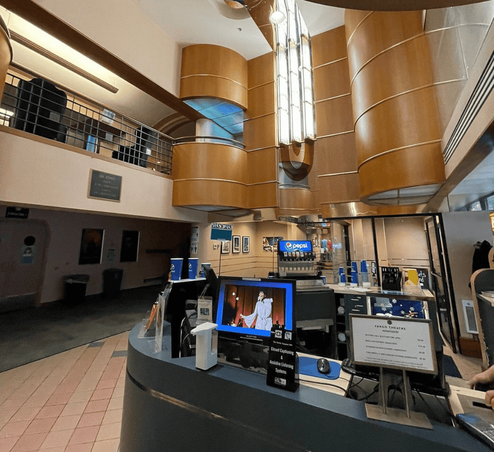 Emergency services entrance at QuestForDirections, modern interior with wood accents and digital check-in system.