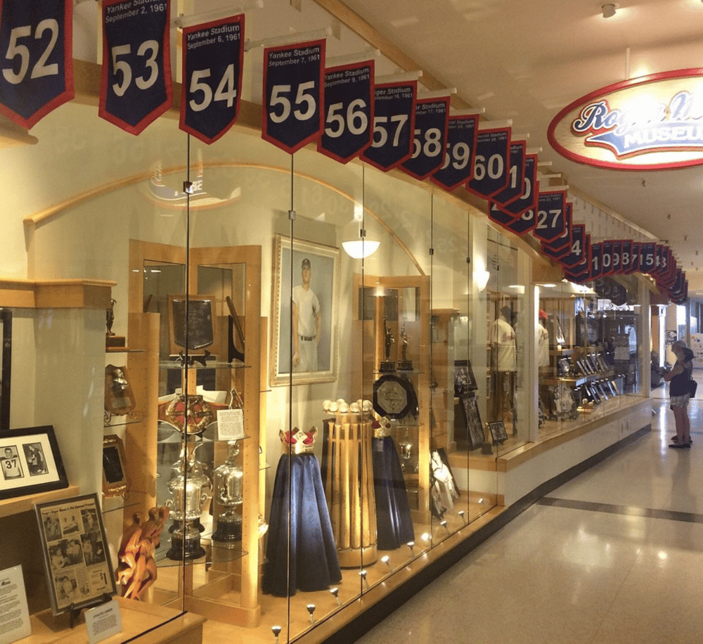Vintage sports memorabilia display at the Roosevelt Museum, showcasing historic trophies and artifacts.