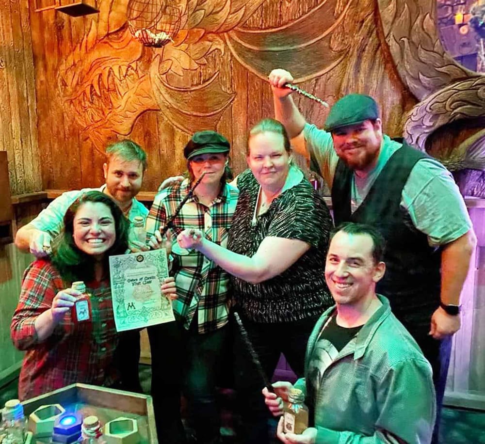 Whimsical pirate-themed escape room with friends celebrating and solving puzzles together.