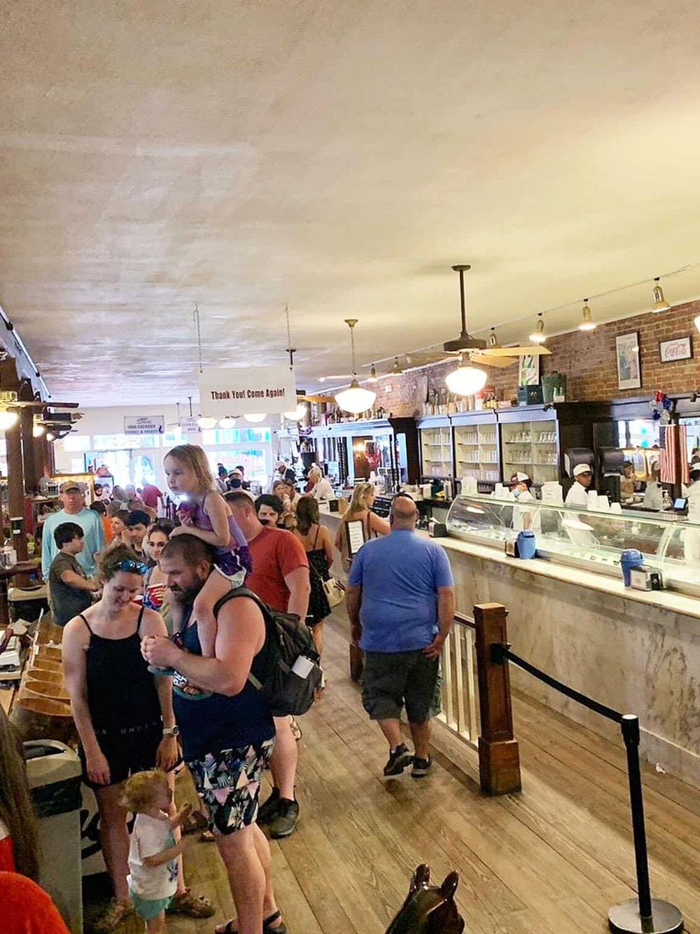 Busy restaurant interior with customers, ordering counter, and casual dining ambiance at QuestForDirections.