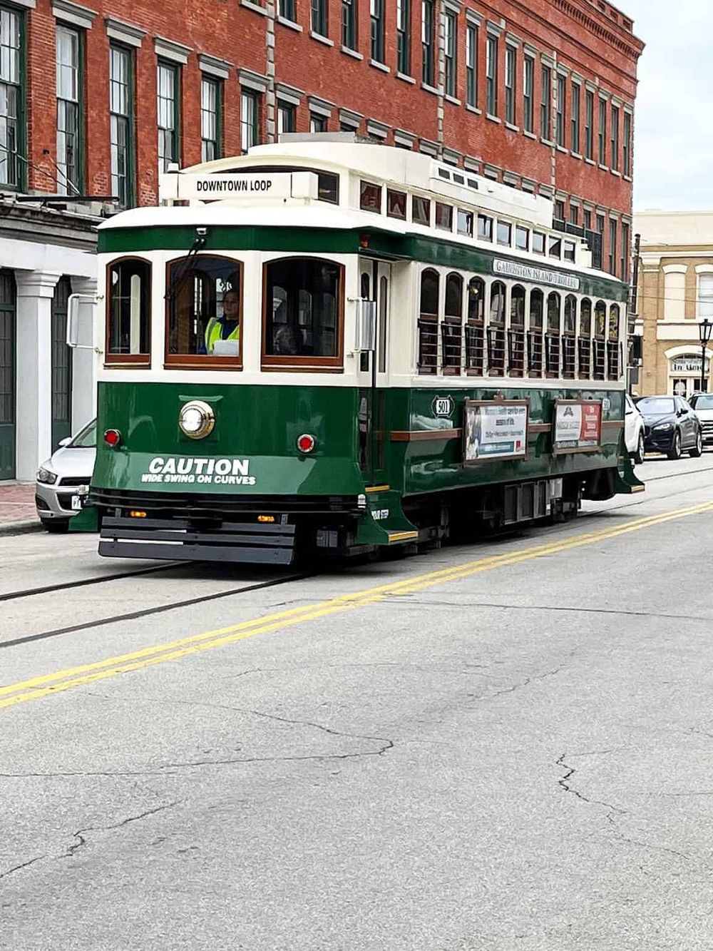 Vintage trolley tram in downtown city area, part of QuestForDirections transportation tours.
