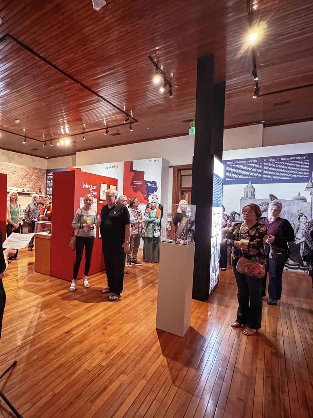 People exploring a historical exhibit at Mexico's revolutionary history museum.