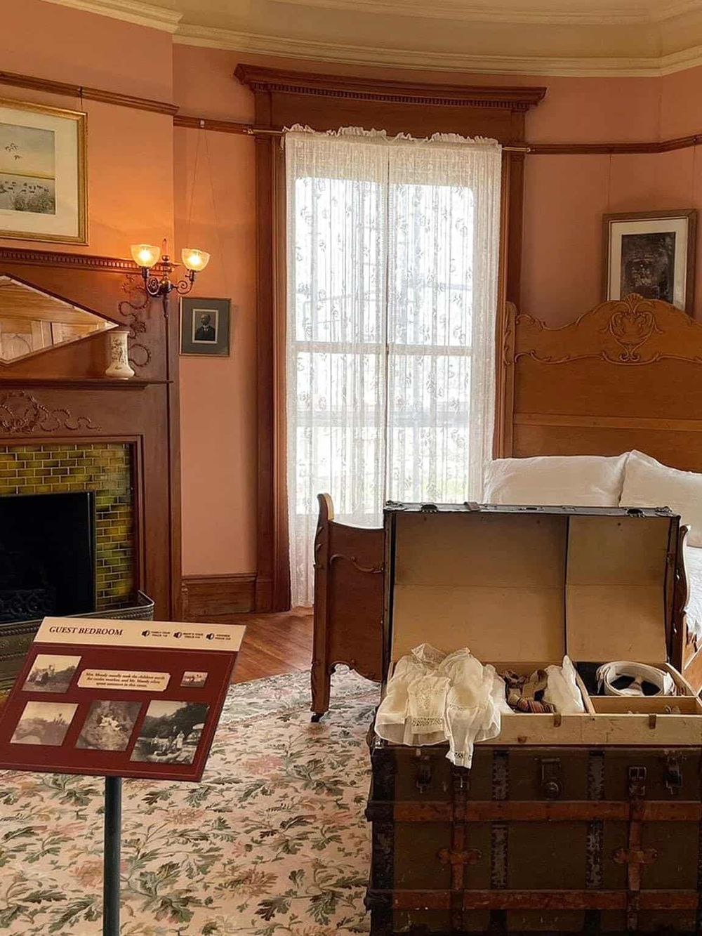 Vintage guest bedroom with antique wooden furniture and classic decor for comfortable stay.