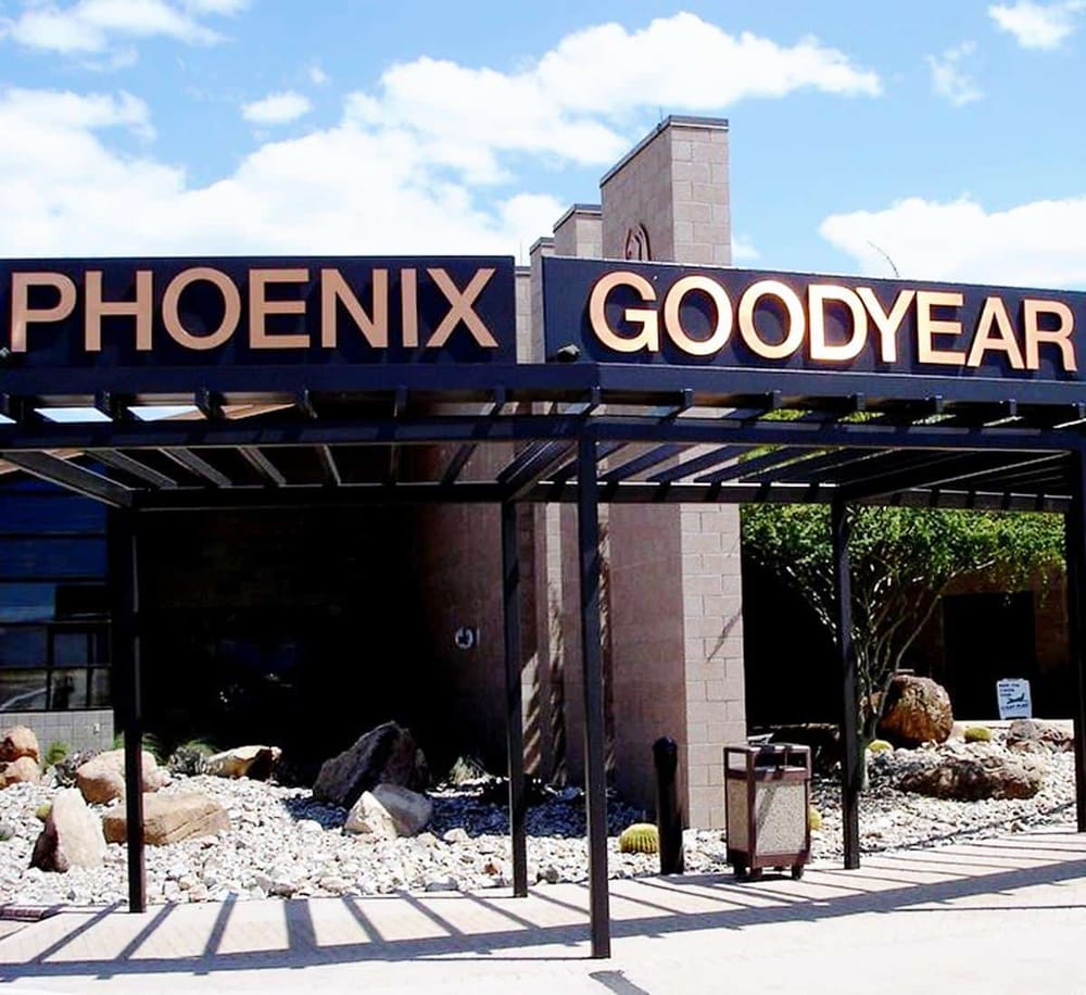 Phoenix Goodyear sign at the shopping center entrance, part of QuestForDirections| Navigation services.