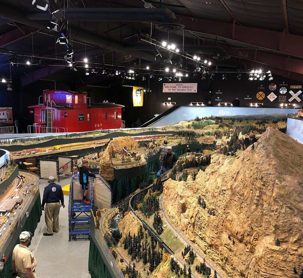 1. Detailed model train layout with mountains and tracks at Quest for Directions exhibit.