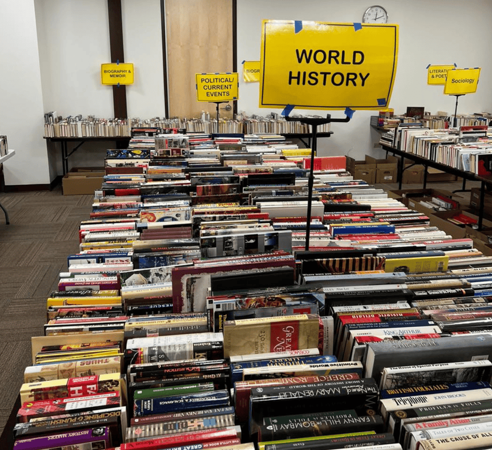 1. Wide view of a library section with books on world history and related topics.