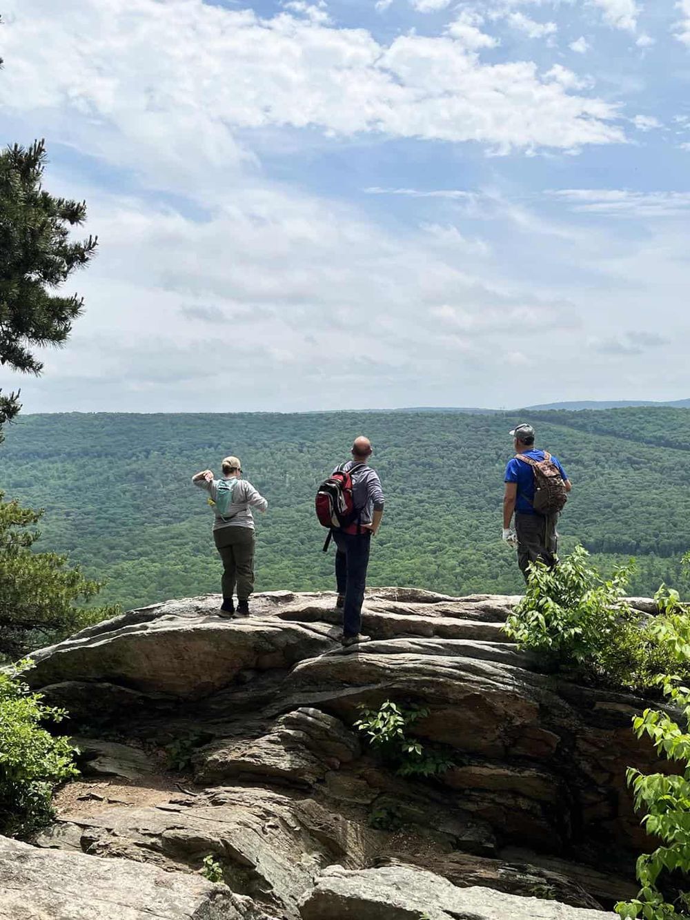 Breathtaking mountain view with hikers enjoying the scenic lookout, perfect for Adventure Seekers and Nature Lovers.