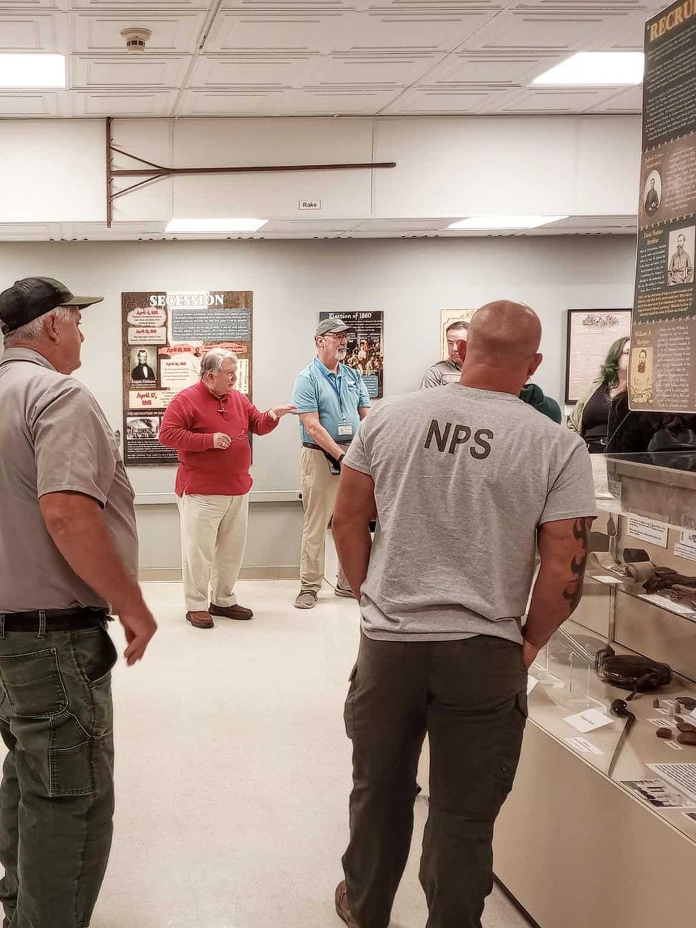 Historical museum exhibit with visitors learning about the Civil War era and secession.