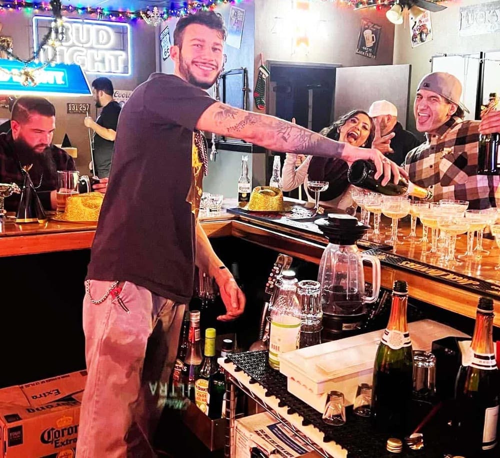 Cheerful bartender pouring drinks at a lively bar, enjoying a festive night out with friends.