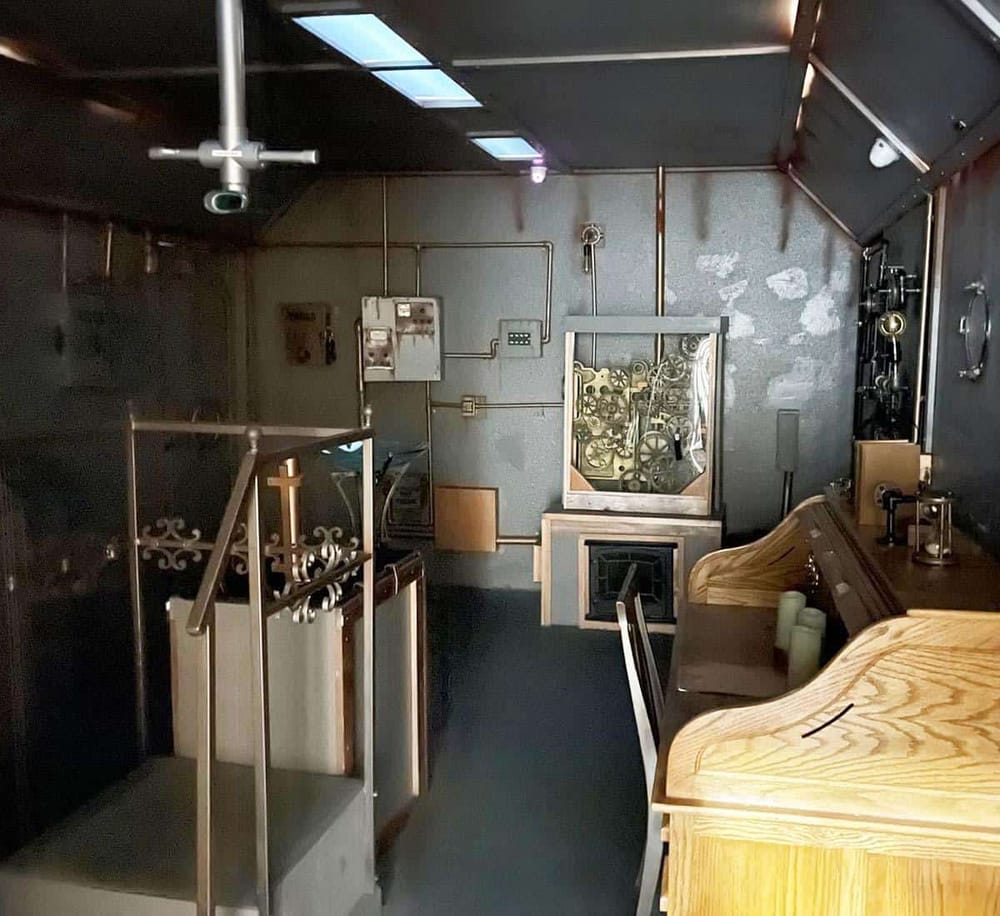 Antique mechanical gears and vintage machinery display in a historic clock museum.