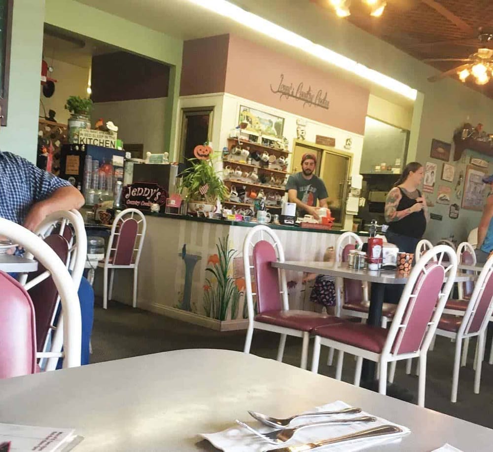 Cozy family-friendly restaurant interior with colorful decor and seated guests, ideal for casual dining.