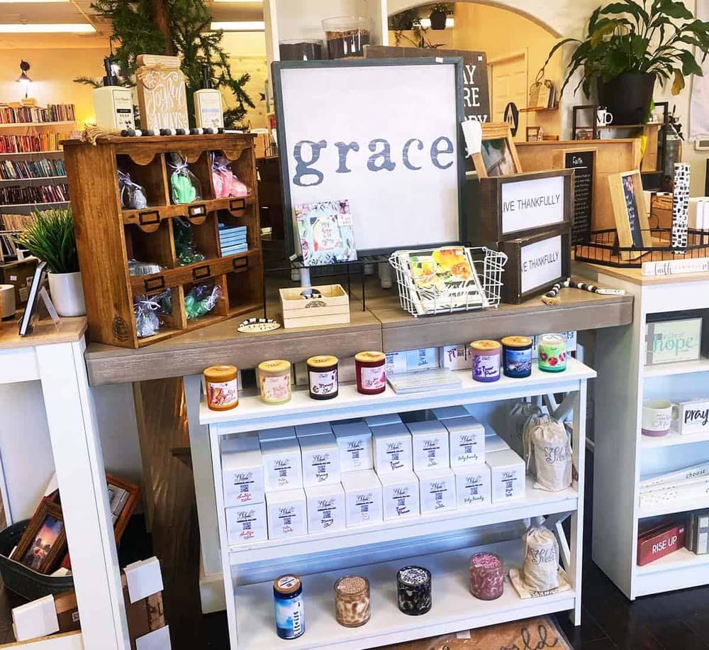 Relaxing bookstore display with inspirational decor and gift items for peaceful shopping experiences.