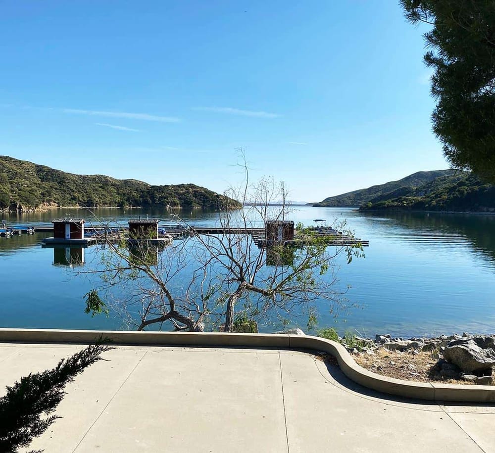 Tranquil waters and mountain views at a scenic marina by QuestForDirections.