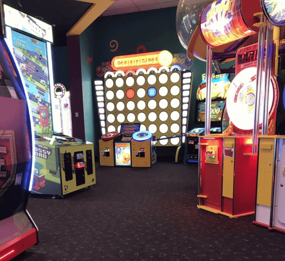 1. Arcade games and redemption attractions at QuestForDirections amusement center.