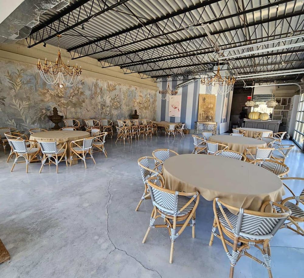 Elegant event space with chandelier lighting, classic decor, and seating area for special occasions.