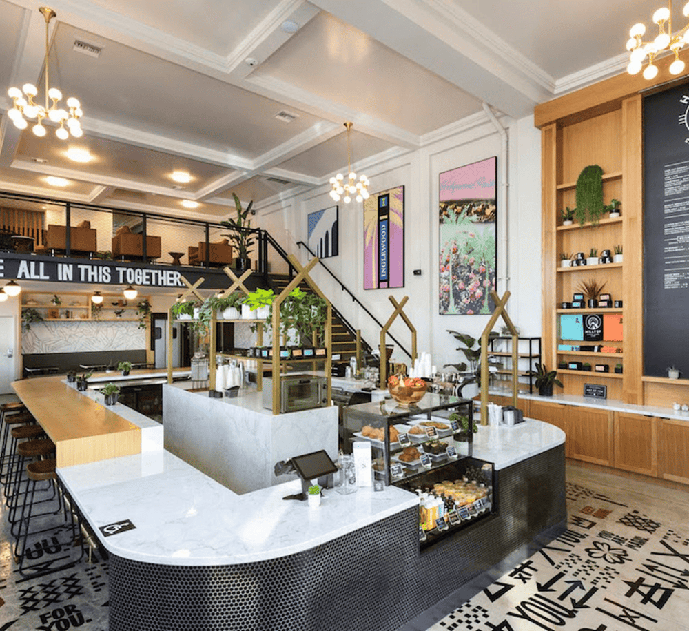 Modern coffee shop interior with stylish decor and cozy seating, perfect for relaxing or working.