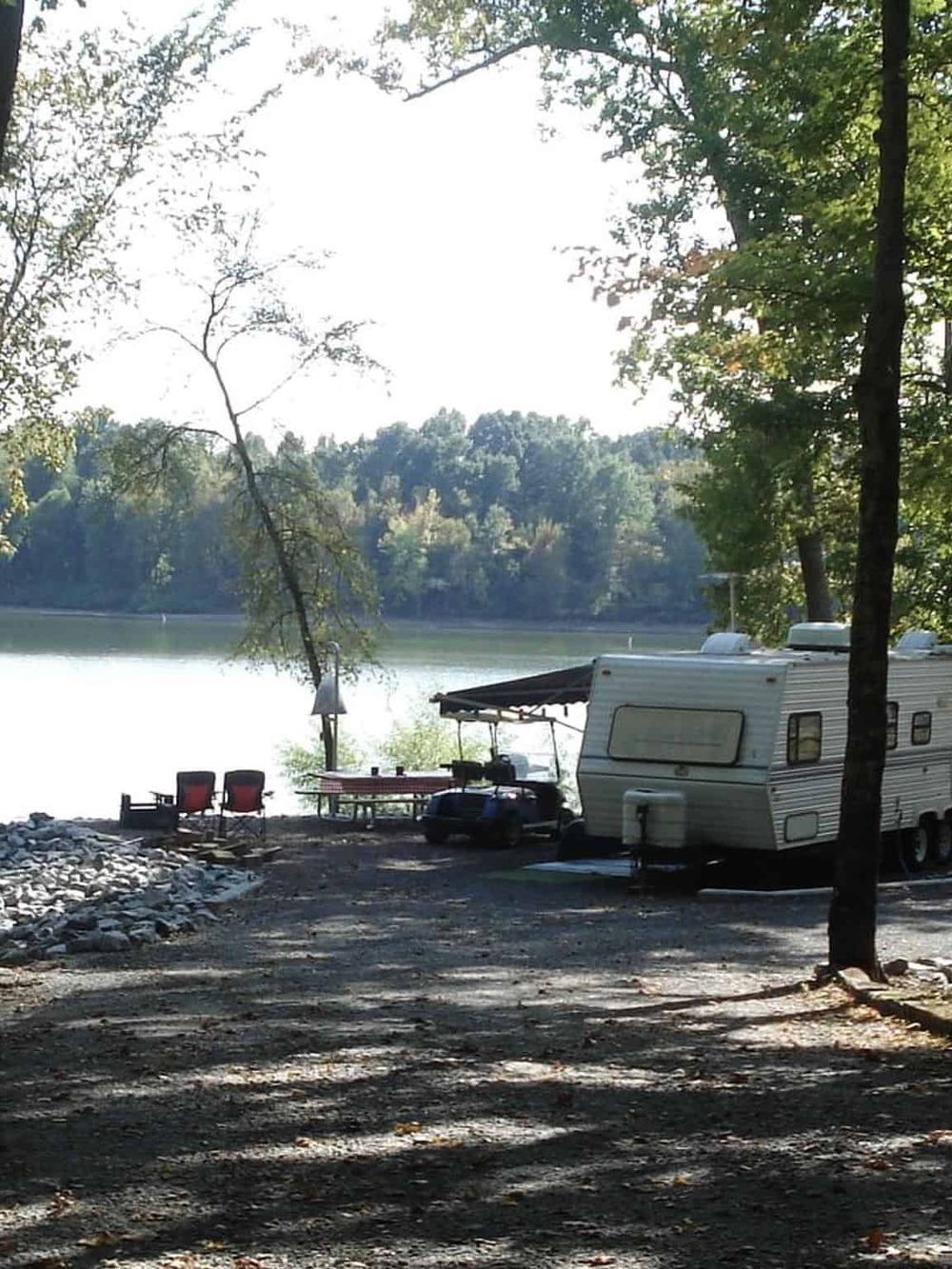 Tranquil lakeside camping spot with a scenic view, perfect for outdoor adventures and relaxation.