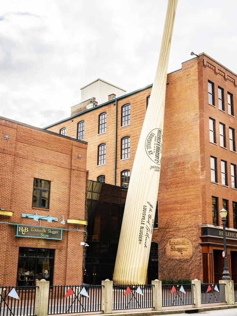 Giant Louisville Slugger baseball bat sculpture outside Louisville Slugger Museum. Famous Kentucky baseball landmark.