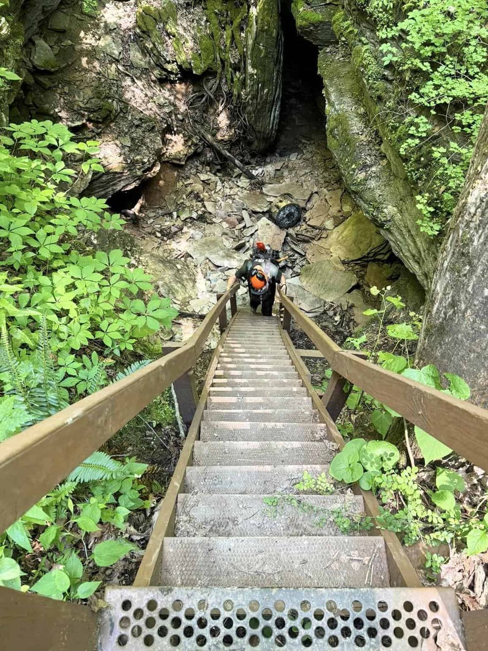 Hidden cave adventure, hiking trail, lush green forest, QuestForDirections explorer exploring nature’s secrets.