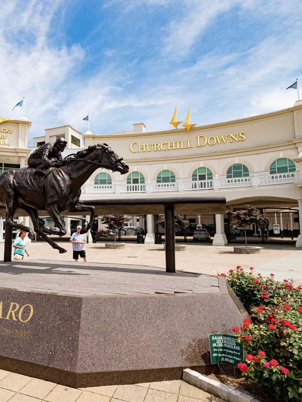 Statue of a jockey riding a horse at Churchill Downs, famous horse racing venue in Louisville, Kentucky.